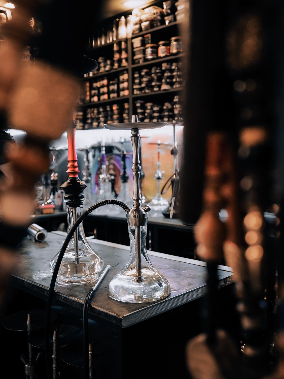 Premium shisha with glowing coals in a moody lounge setting
